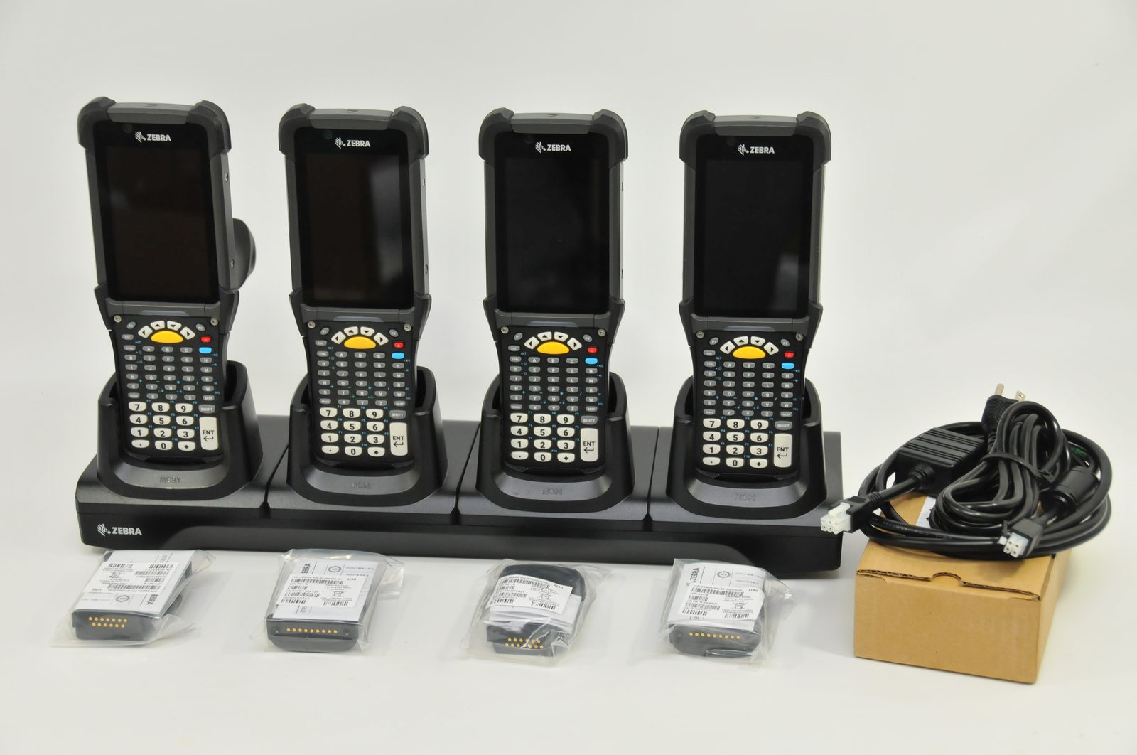 Zebra MC93 handheld computers in a multi-slot charging cradle